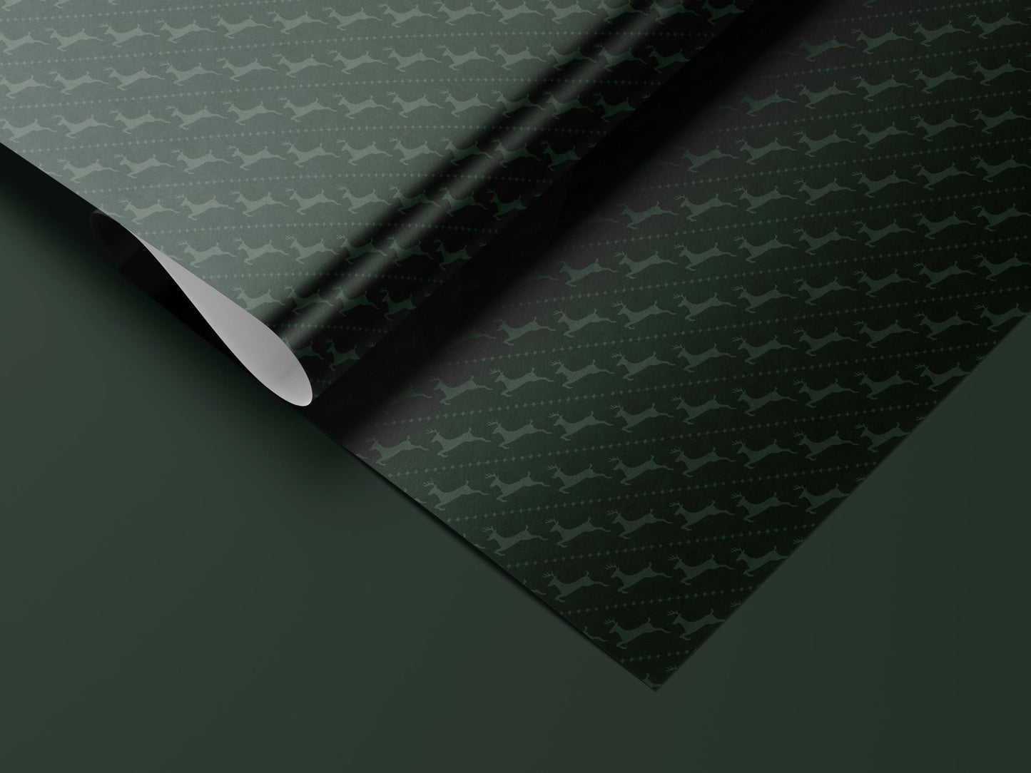 Green reindeer wrapping paper roll — Evara Creative Studio