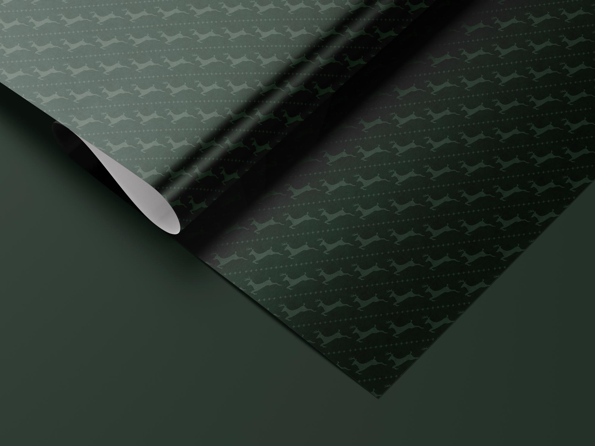 Green reindeer wrapping paper roll — Evara Creative Studio