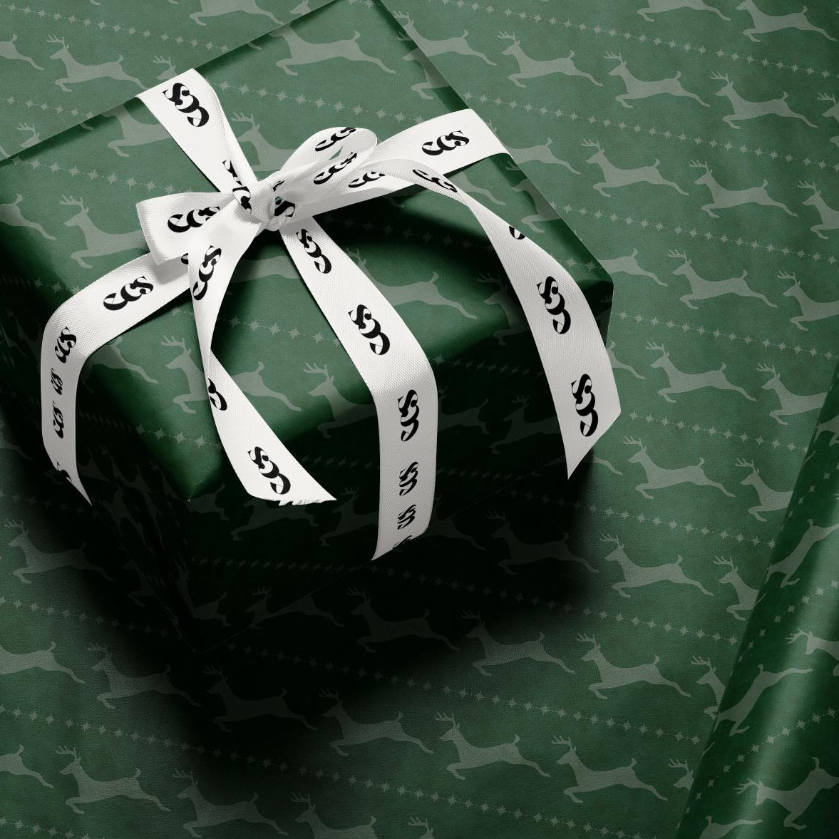 Green reindeer Christmas wrapping paper — Evara Creative Studio