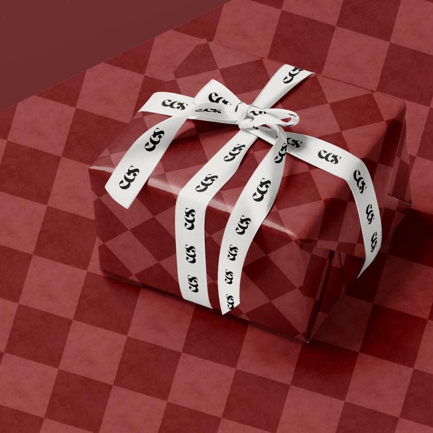 Red checkerboard wrapping paper roll — Evara Creative Studio